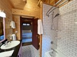Full bathroom with double vanity and beautiful tile shower 